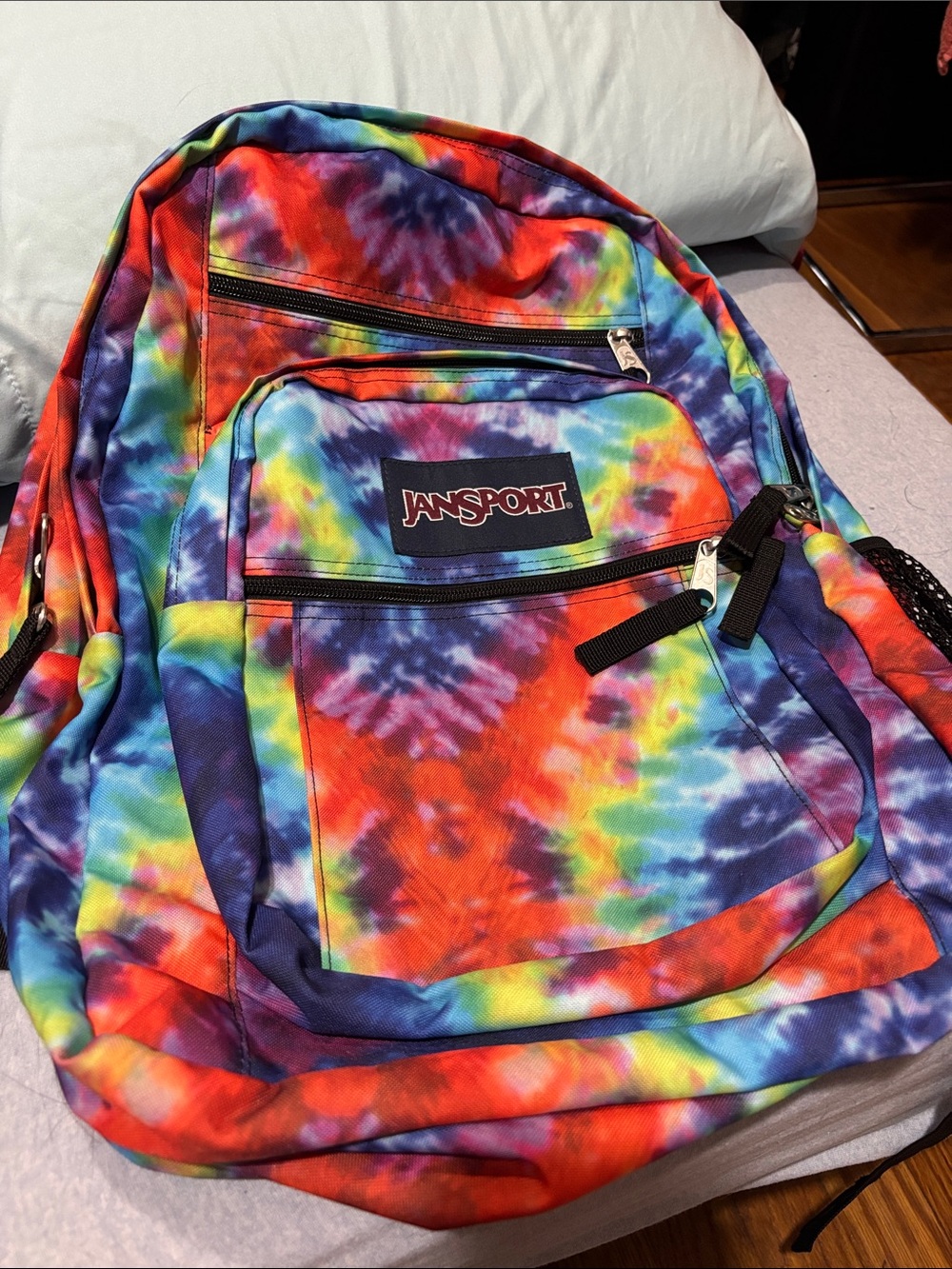Jansport Tie-Dye Rainbow Backpack in Red, Blue, Yellow, Purple